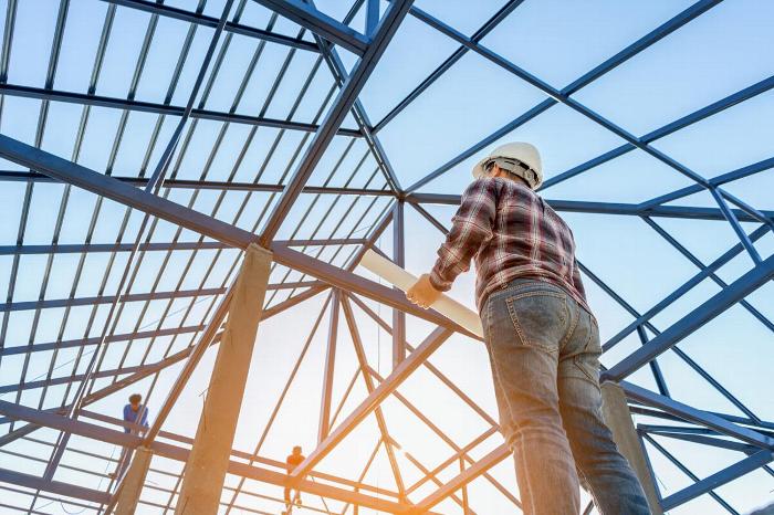 A man building a house frame